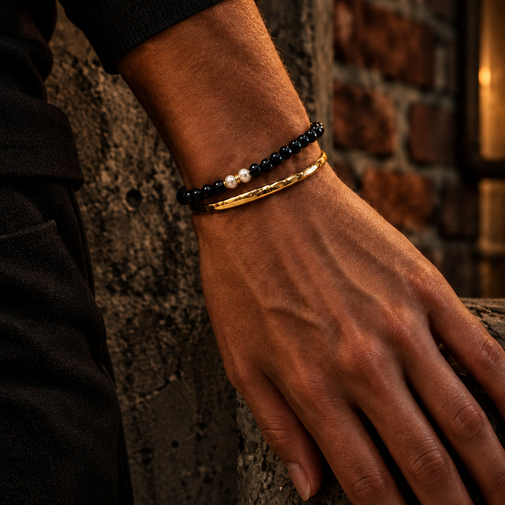 The Luminary pearl bracelet stacked with a gold bangle