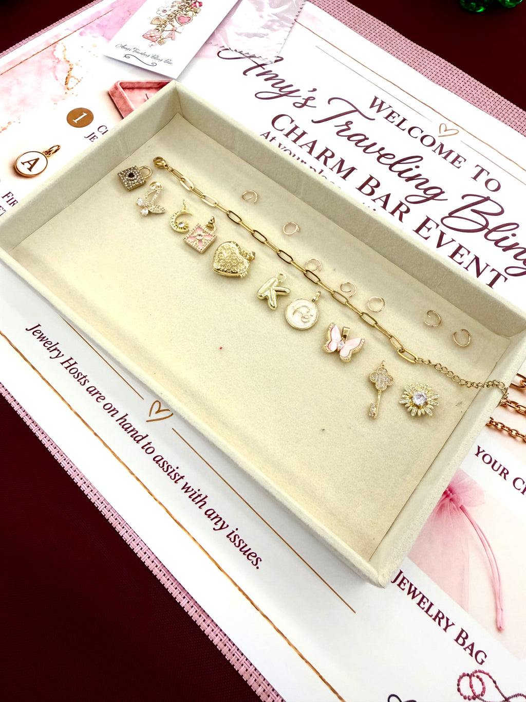 Gold charm bracelet styled with colorful statement charms