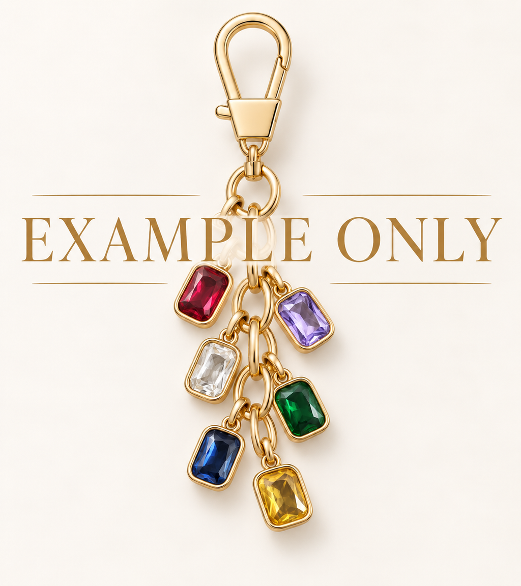 Example only — custom six-charm bag charm with gold hardware and colorful birthstone-style charms